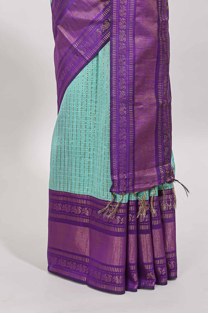Blue checked tussar saree with contrast violet zari border and checked blouse