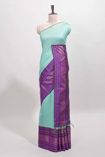 Blue checked tussar saree with contrast violet zari border and checked blouse