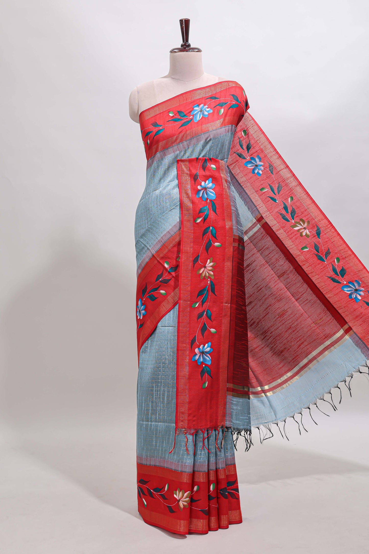 Blue checked semi tussar saree with contrast floral vine border and blouse