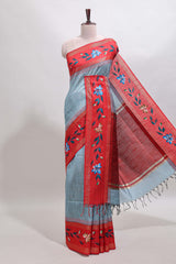 Blue checked semi tussar saree with contrast floral vine border and blouse