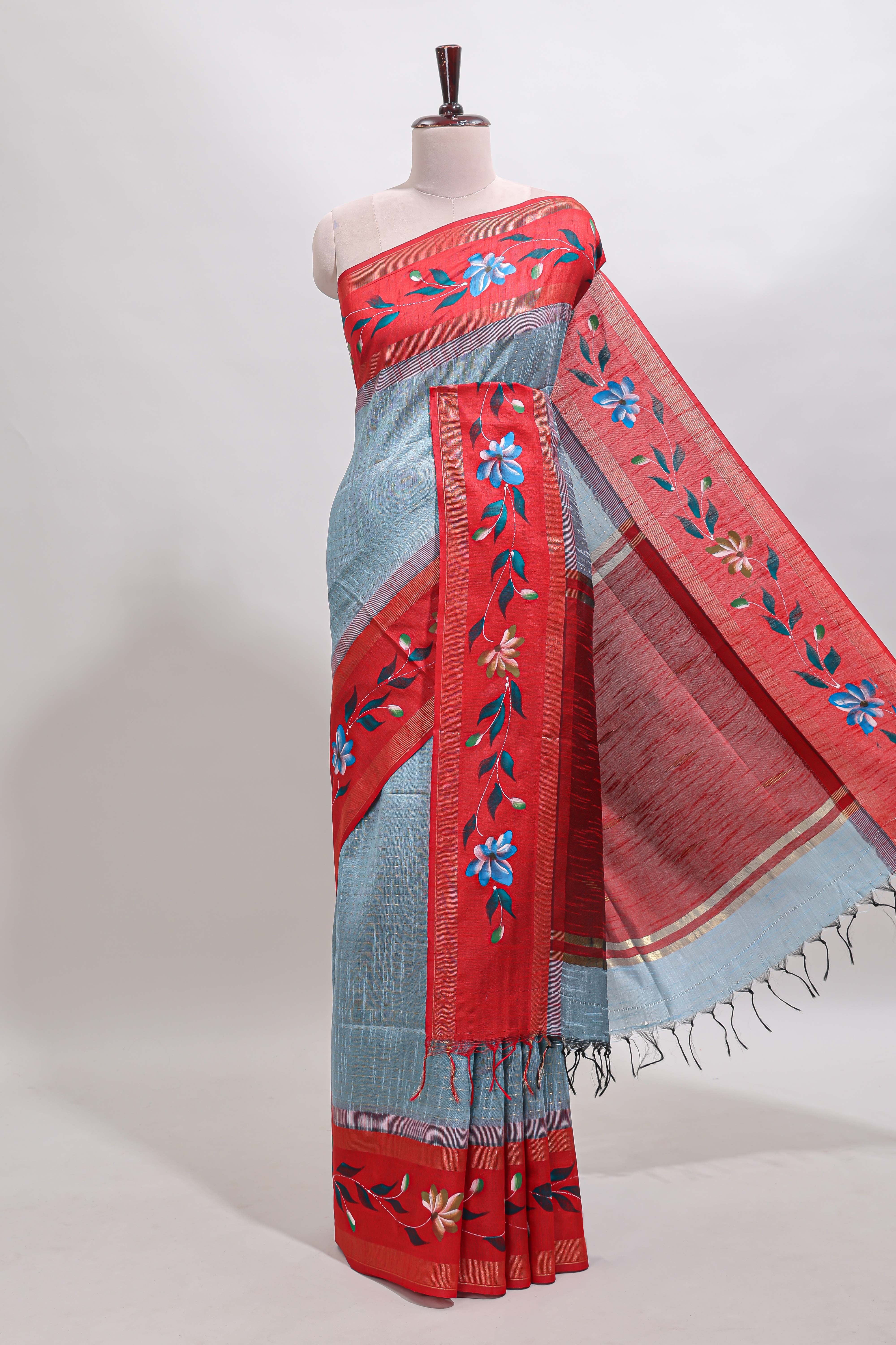 Blue checked semi tussar saree with contrast floral vine border and blouse
