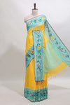 Yellow checked semi tussar saree with contrast floral vine border and blouse