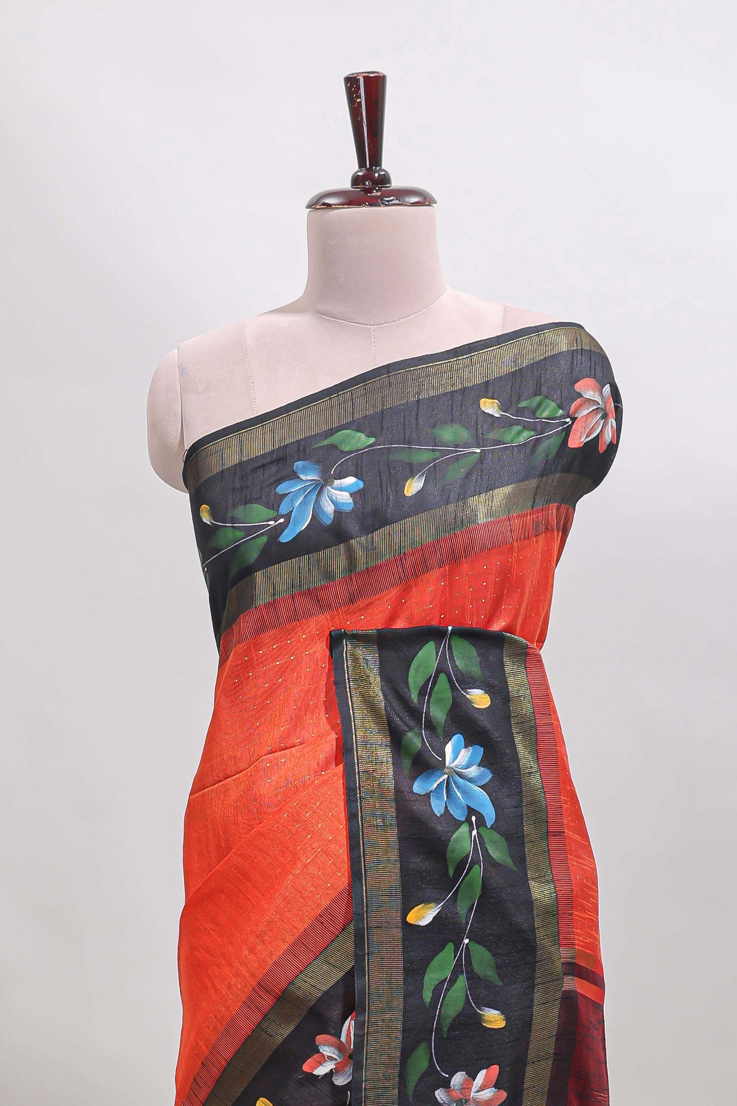 Orange checked semi tussar saree with contrast floral vine border and blouse