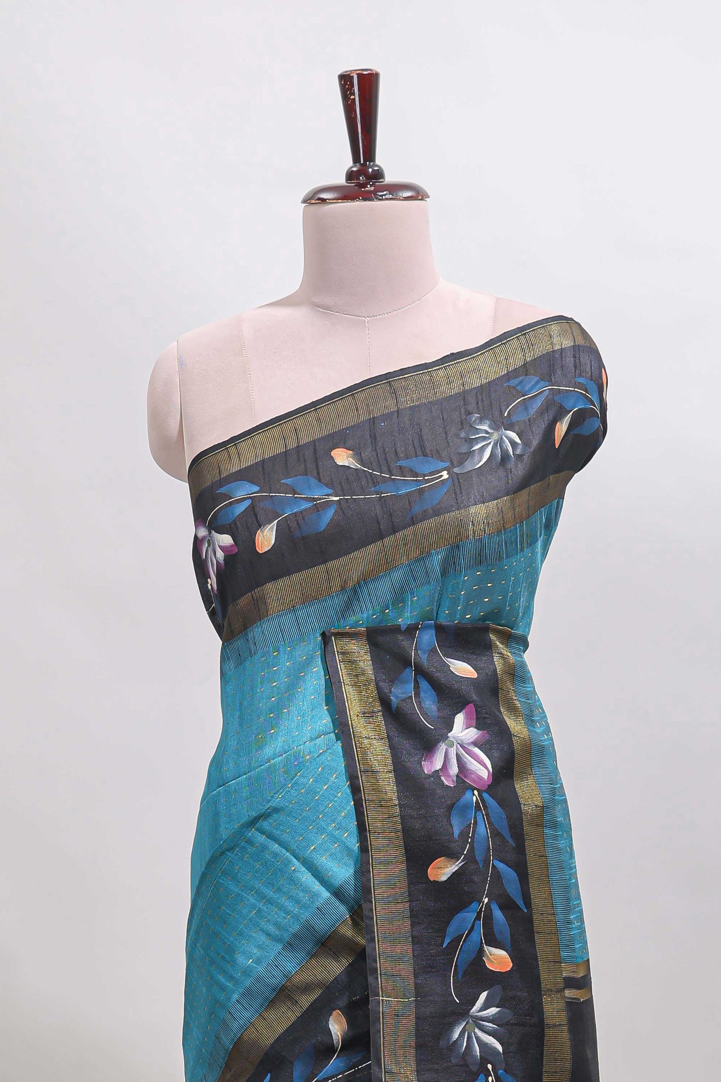 Teal blue checked semi tussar saree with contrast floral vine border and blouse
