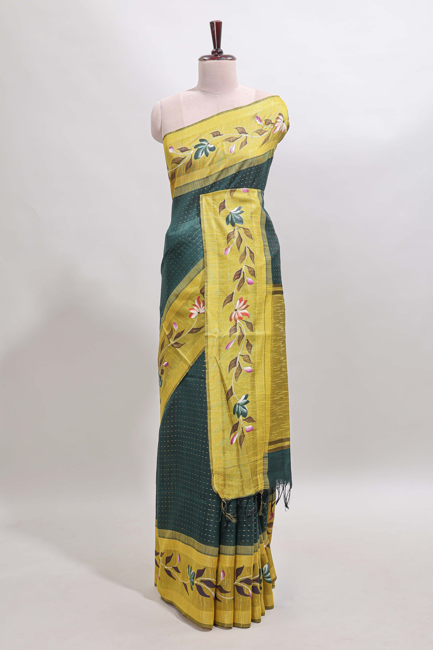 Green checked semi tussar saree with contrast floral vine border and blouse