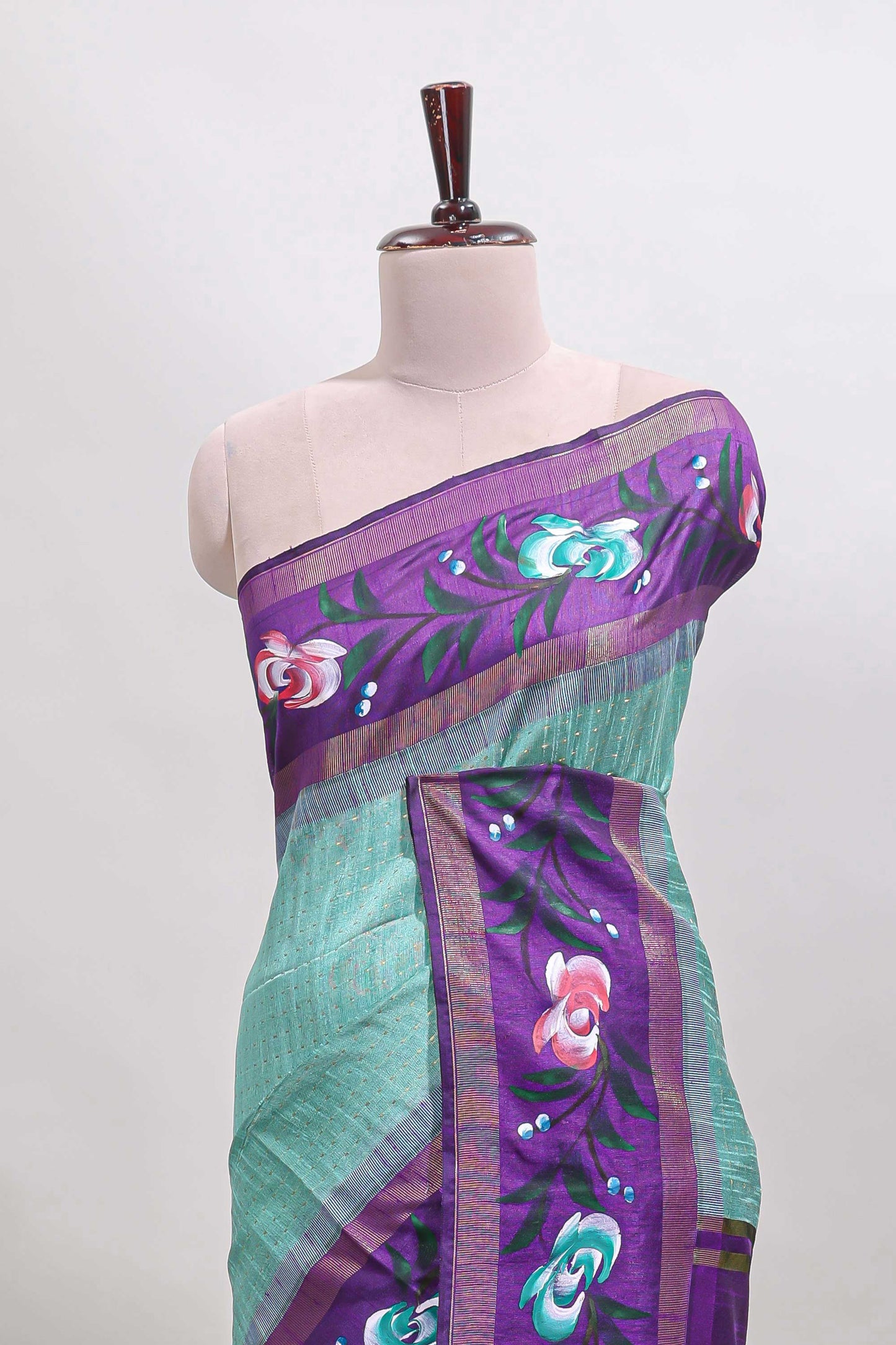 Green checked semi tussar saree with contrast violet floral vine border and blouse