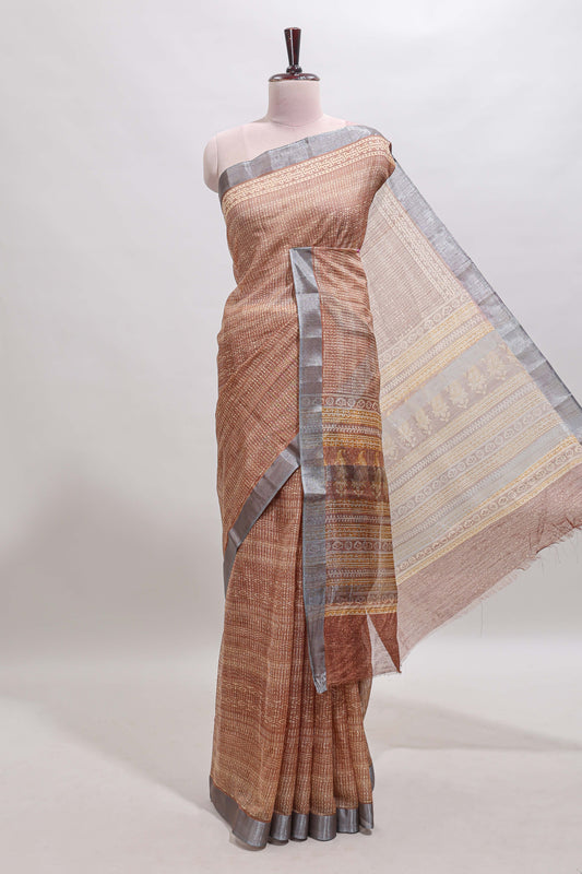 Brown geometric design semi tussar saree with contrast border and matching blouse