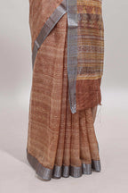 Brown geometric design semi tussar saree with contrast border and matching blouse
