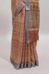 Brown geometric design semi tussar saree with contrast border and matching blouse
