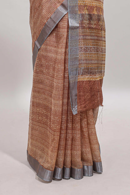 Brown geometric design semi tussar saree with contrast border and matching blouse