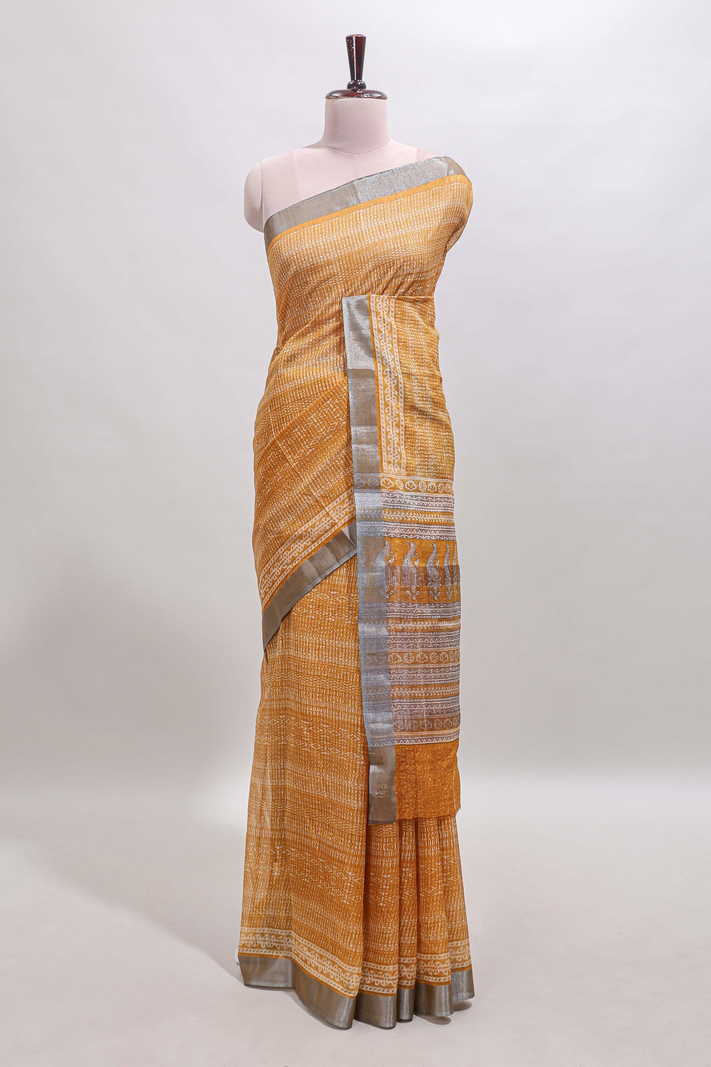 Mustard geometric design semi tussar saree with contrast border and matching blouse