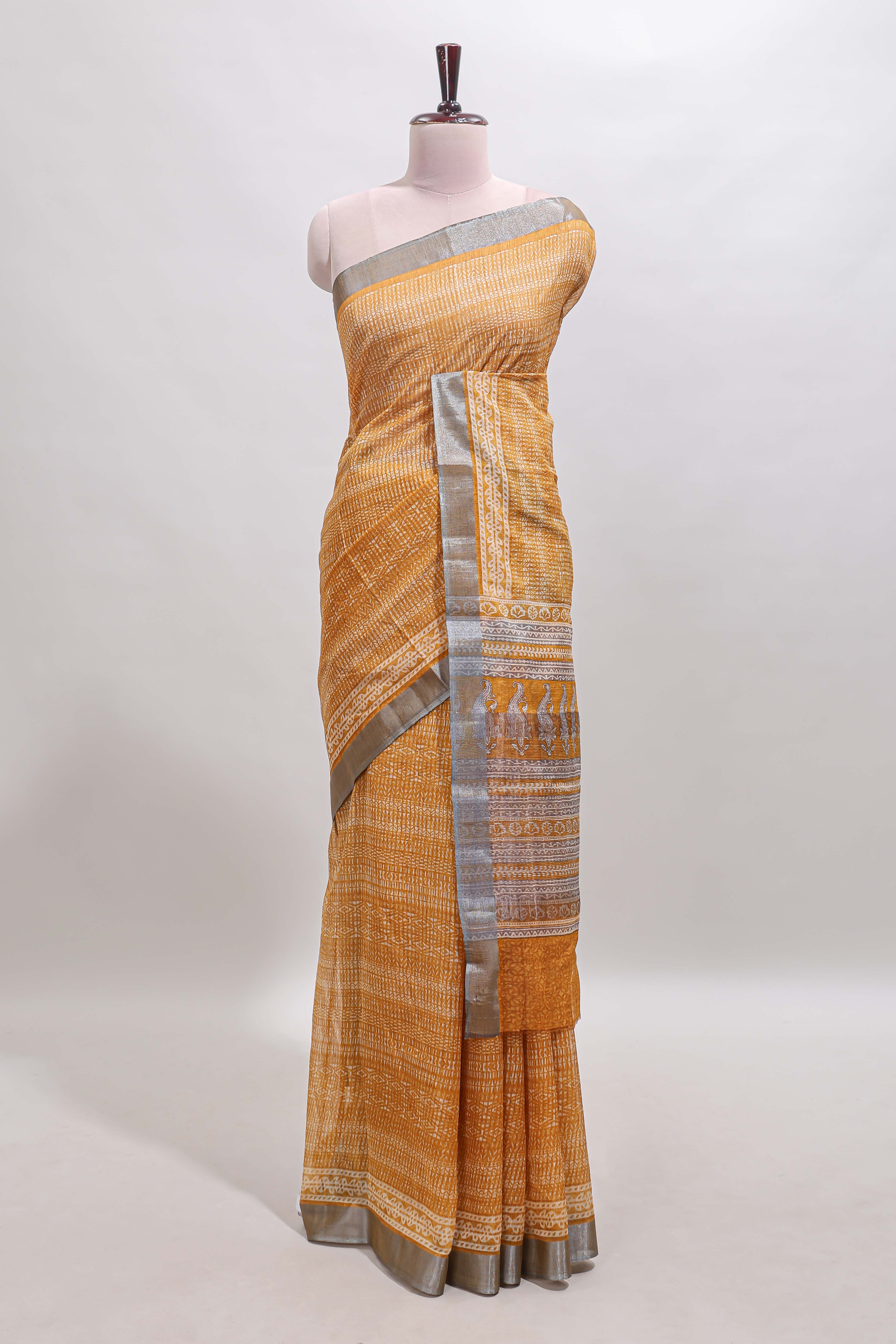Mustard geometric design semi tussar saree with contrast border and matching blouse