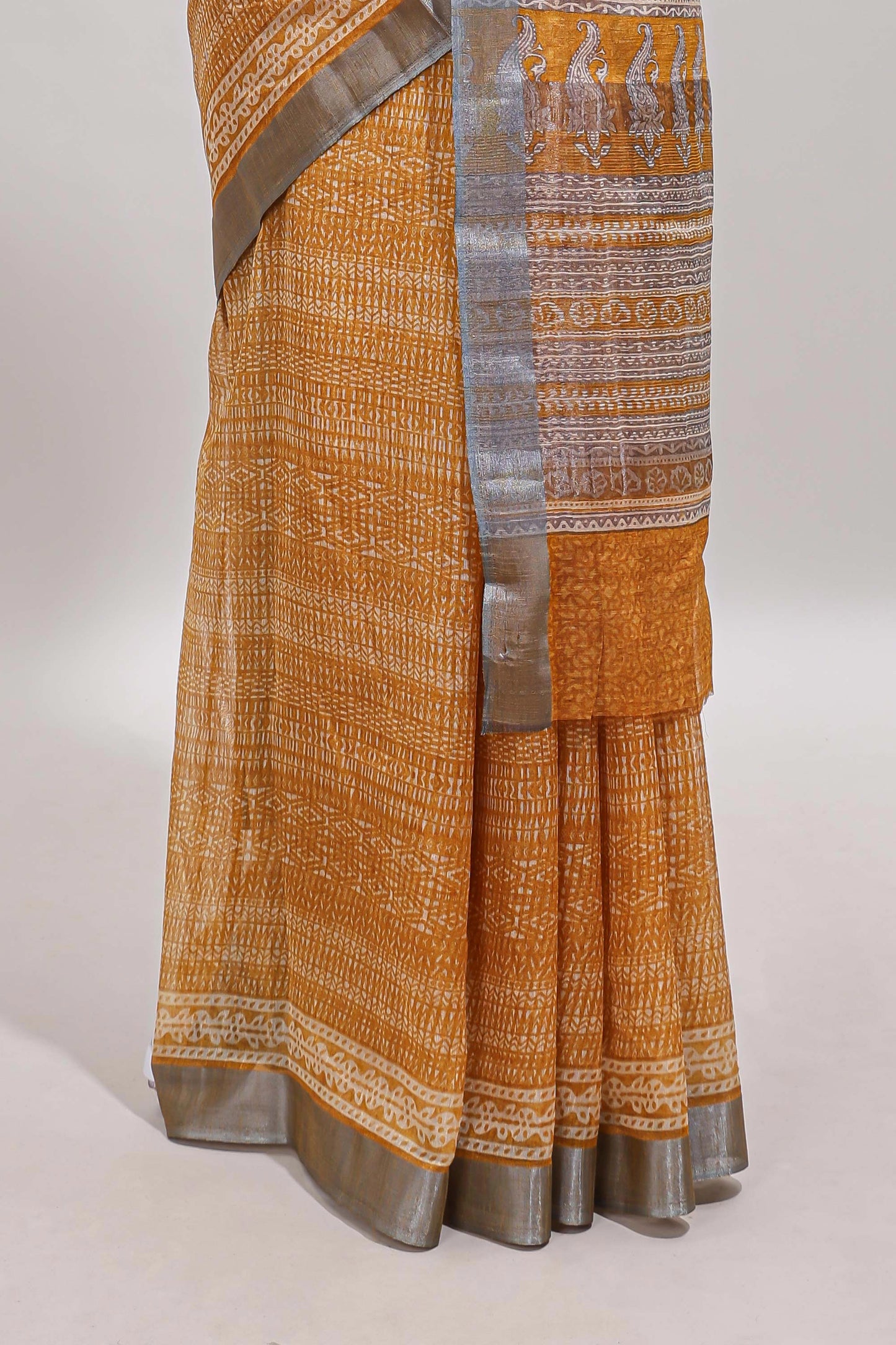 Mustard geometric design semi tussar saree with contrast border and matching blouse
