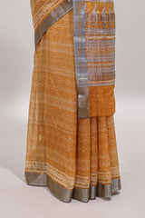 Mustard geometric design semi tussar saree with contrast border and matching blouse