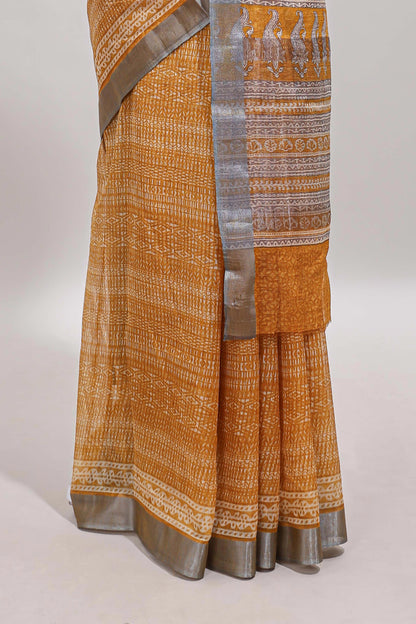 Mustard geometric design semi tussar saree with contrast border and matching blouse