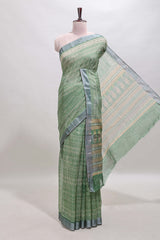 Green geometric design semi tussar saree with contrast border and matching blouse