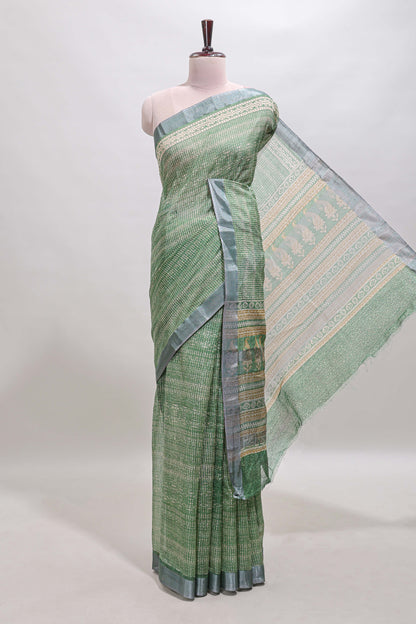 Green geometric design semi tussar saree with contrast border and matching blouse