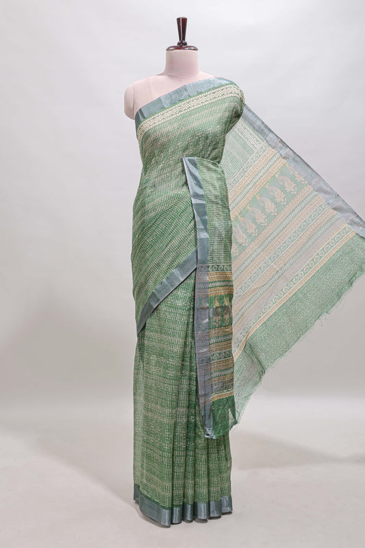 Green geometric design semi tussar saree with contrast border and matching blouse