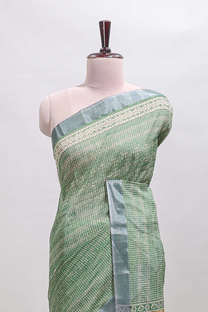 Green geometric design semi tussar saree with contrast border and matching blouse
