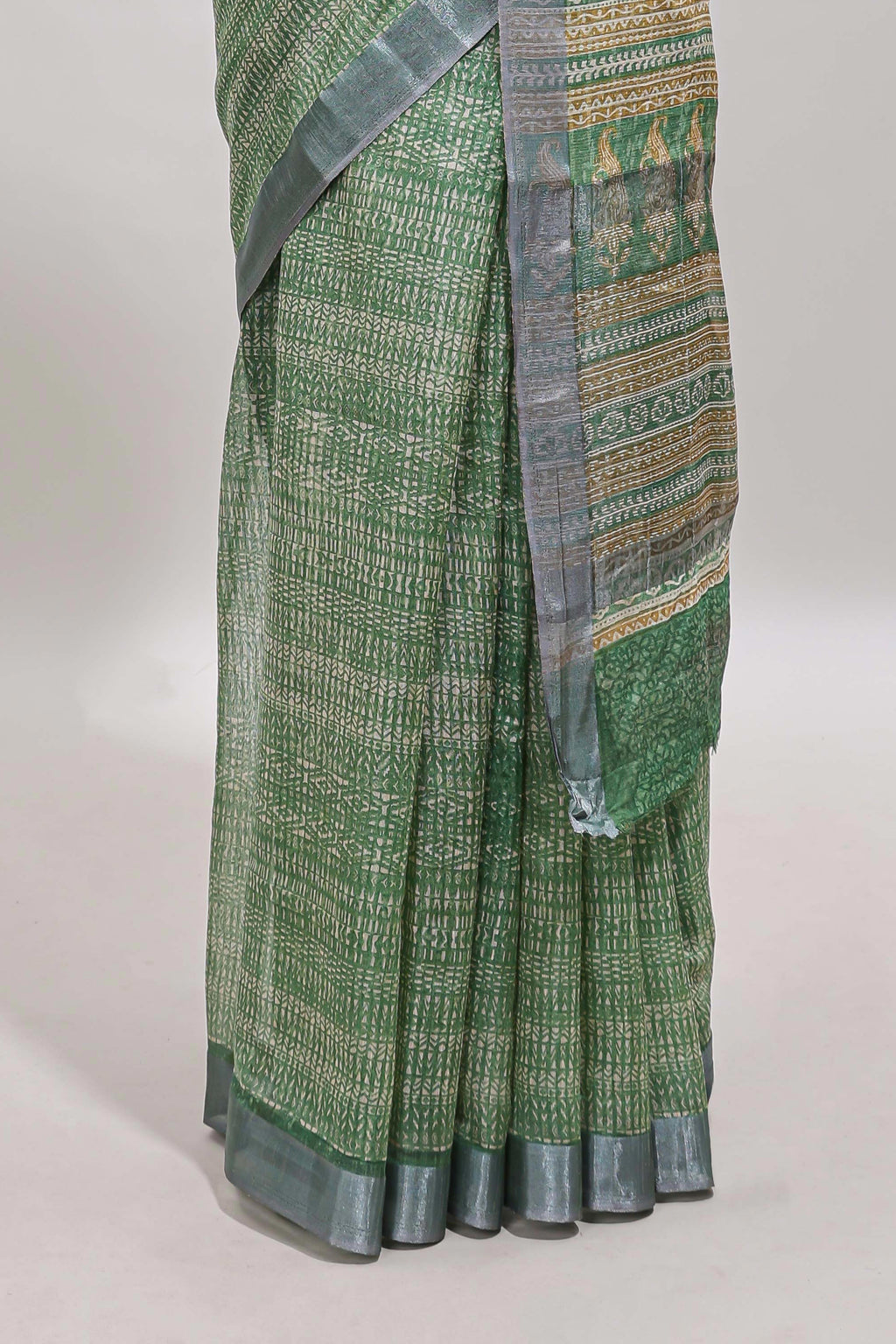 Green geometric design semi tussar saree with contrast border and matching blouse