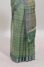 Green geometric design semi tussar saree with contrast border and matching blouse