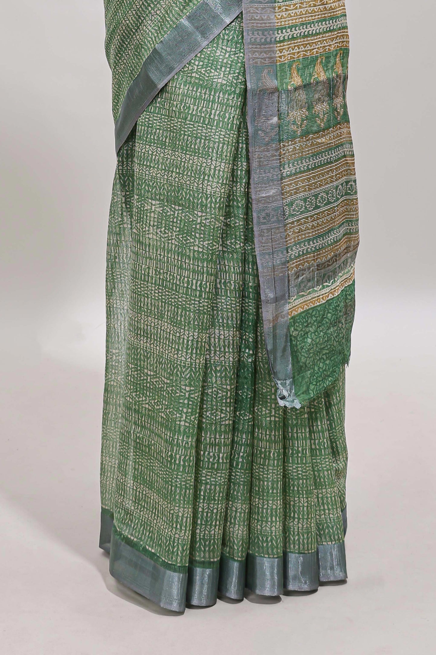 Green geometric design semi tussar saree with contrast border and matching blouse
