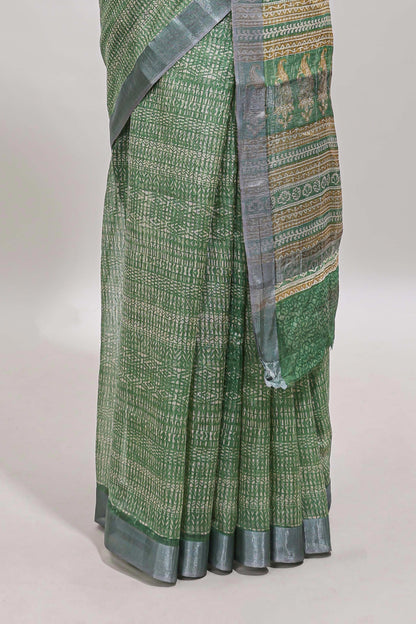 Green geometric design semi tussar saree with contrast border and matching blouse