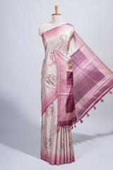 Beige floral & cage print motifs tussar saree with contrast border and blouse