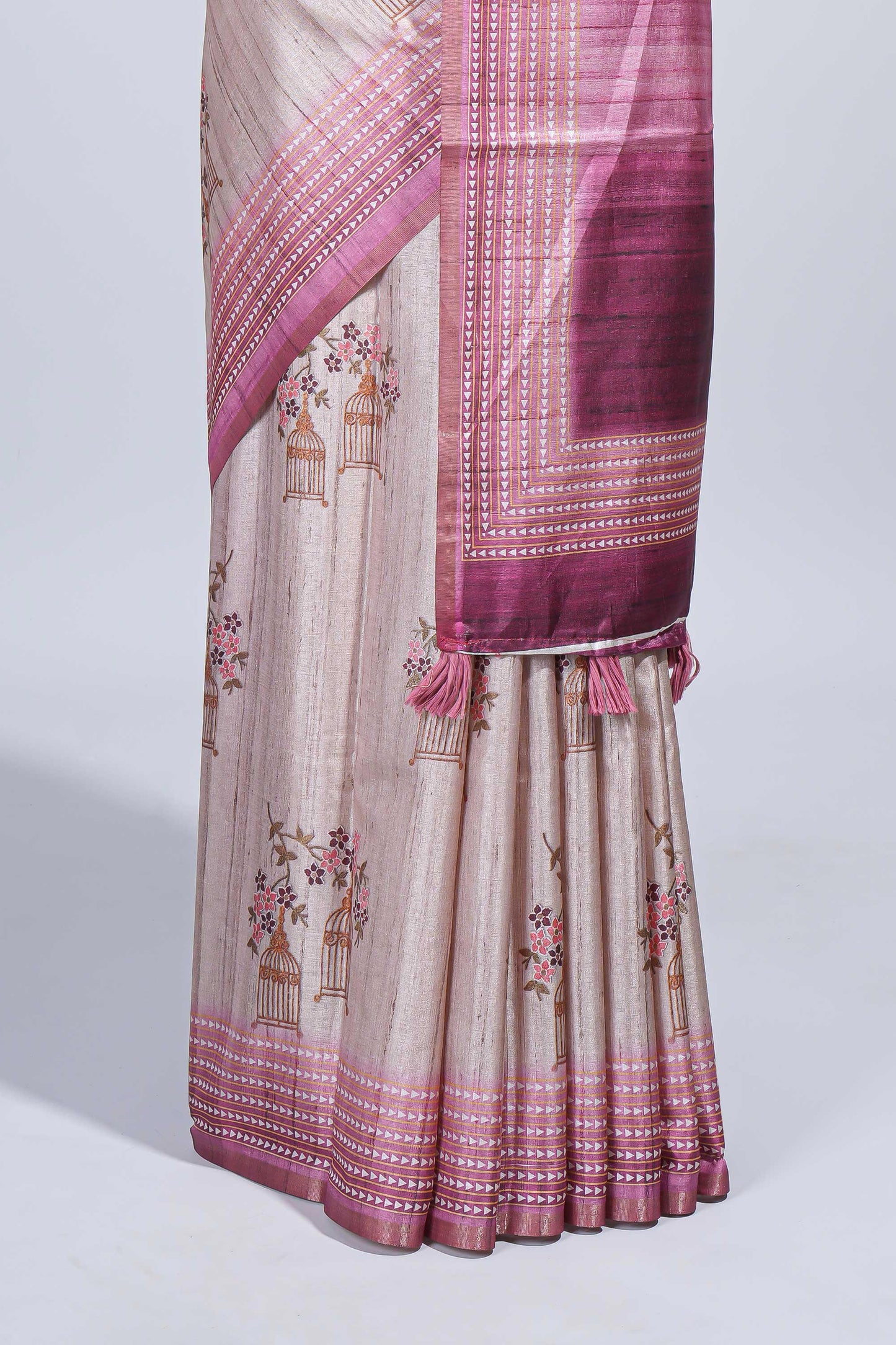 Beige floral & cage print motifs tussar saree with contrast border and blouse