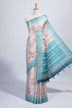 Beige floral & cage print motifs tussar saree with contrast border and blouse