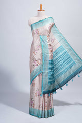 Beige floral & cage print motifs tussar saree with contrast border and blouse
