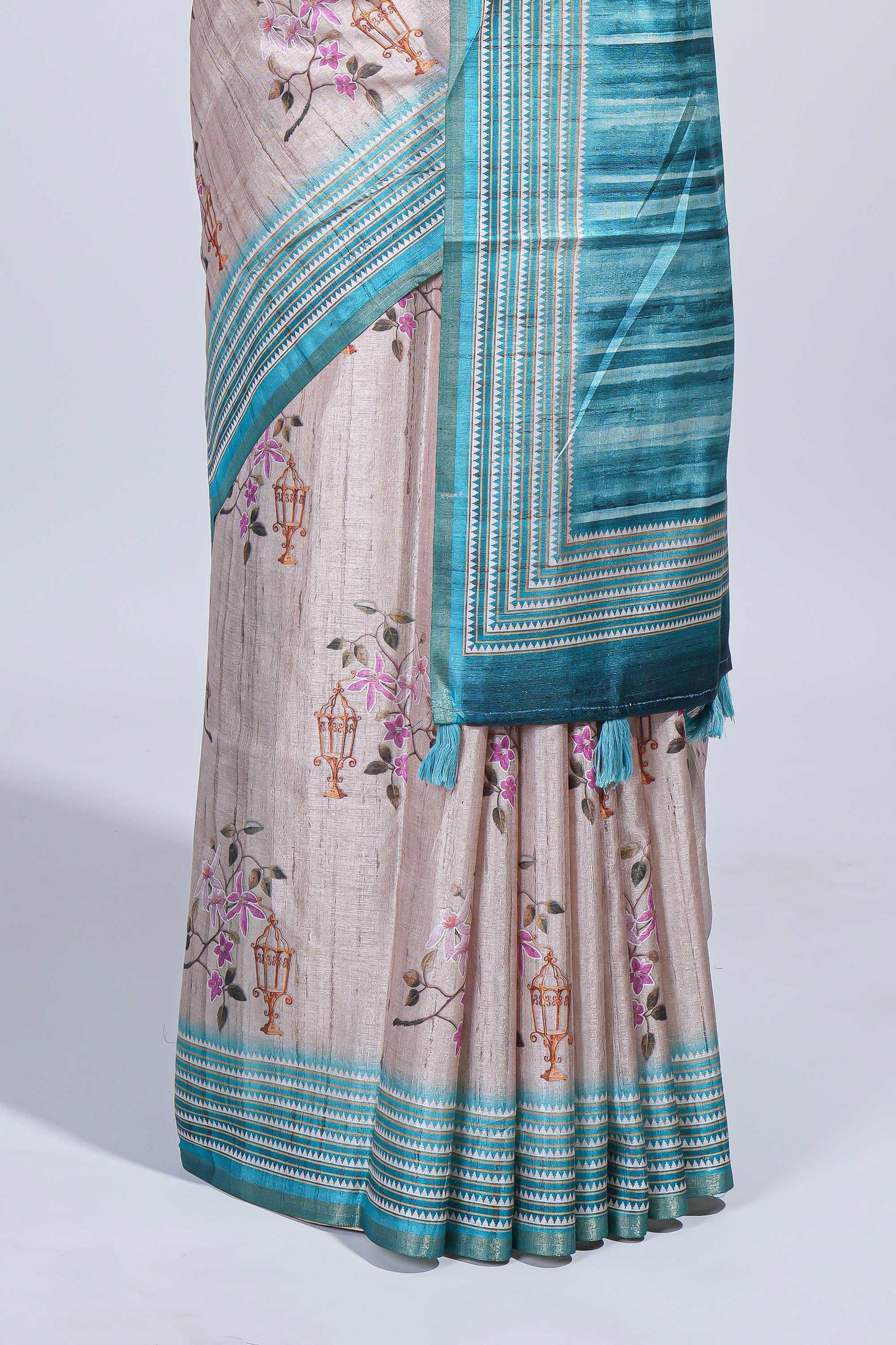 Beige floral & cage print motifs tussar saree with contrast border and blouse