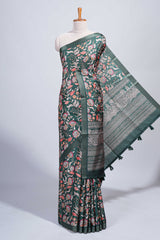 Green floral design tussar saree with self zari border and matching blouse