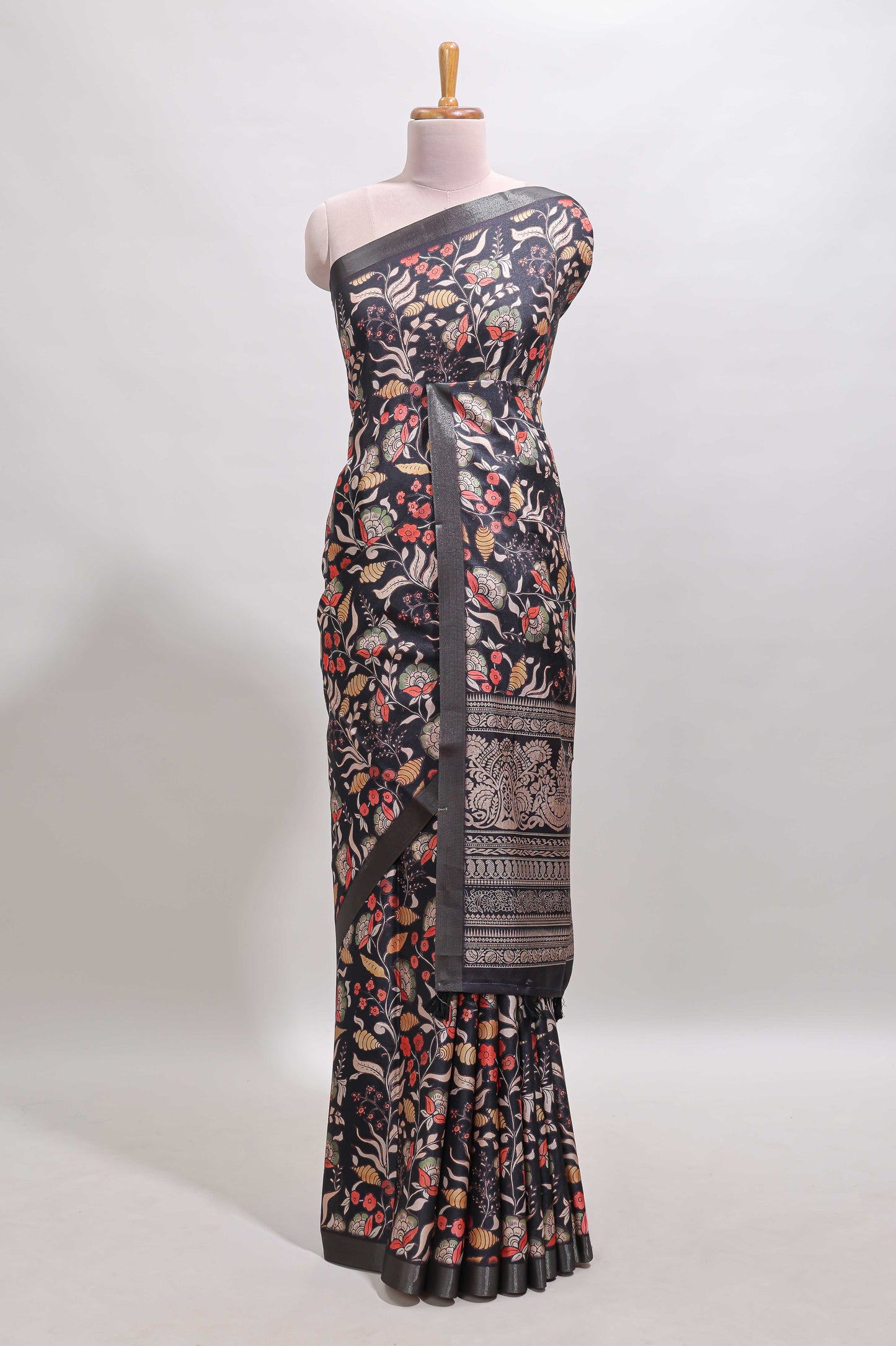 Black floral design tussar saree with self zari border and matching blouse