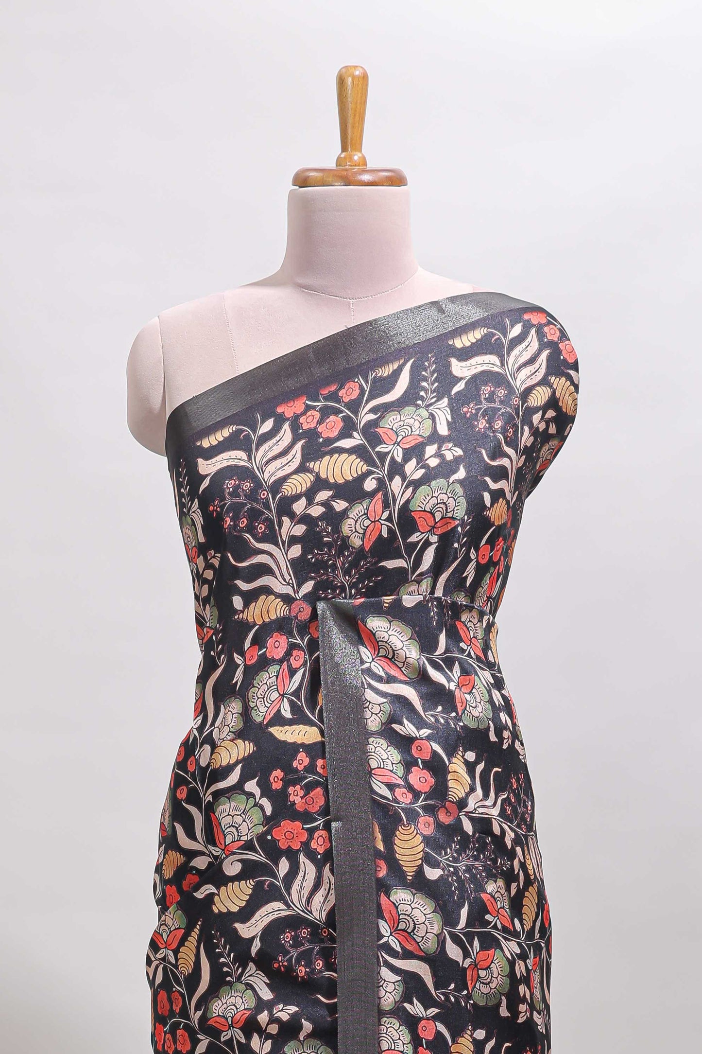 Black floral design tussar saree with self zari border and matching blouse