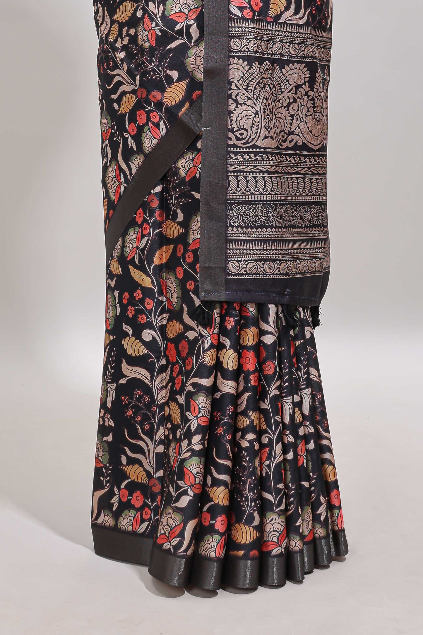 Black floral design tussar saree with self zari border and matching blouse
