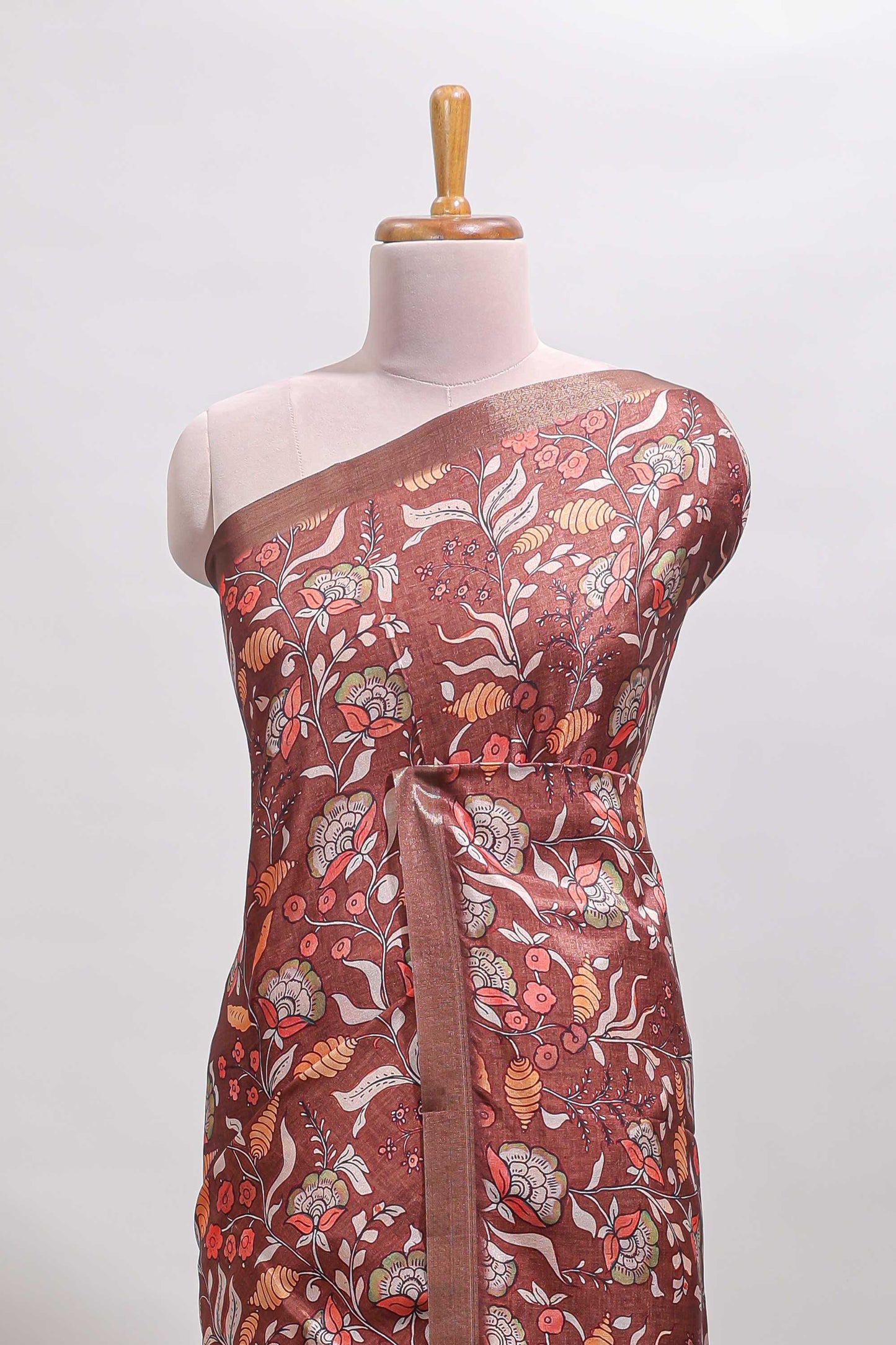 Brown floral design tussar saree with self zari border and matching blouse
