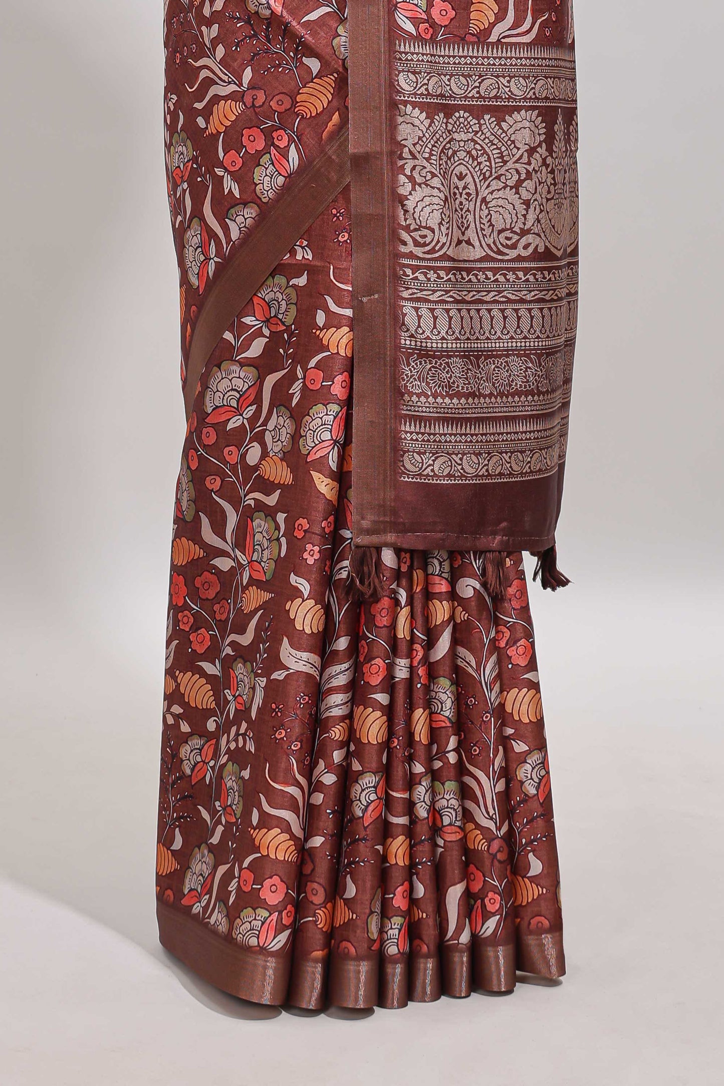 Brown floral design tussar saree with self zari border and matching blouse