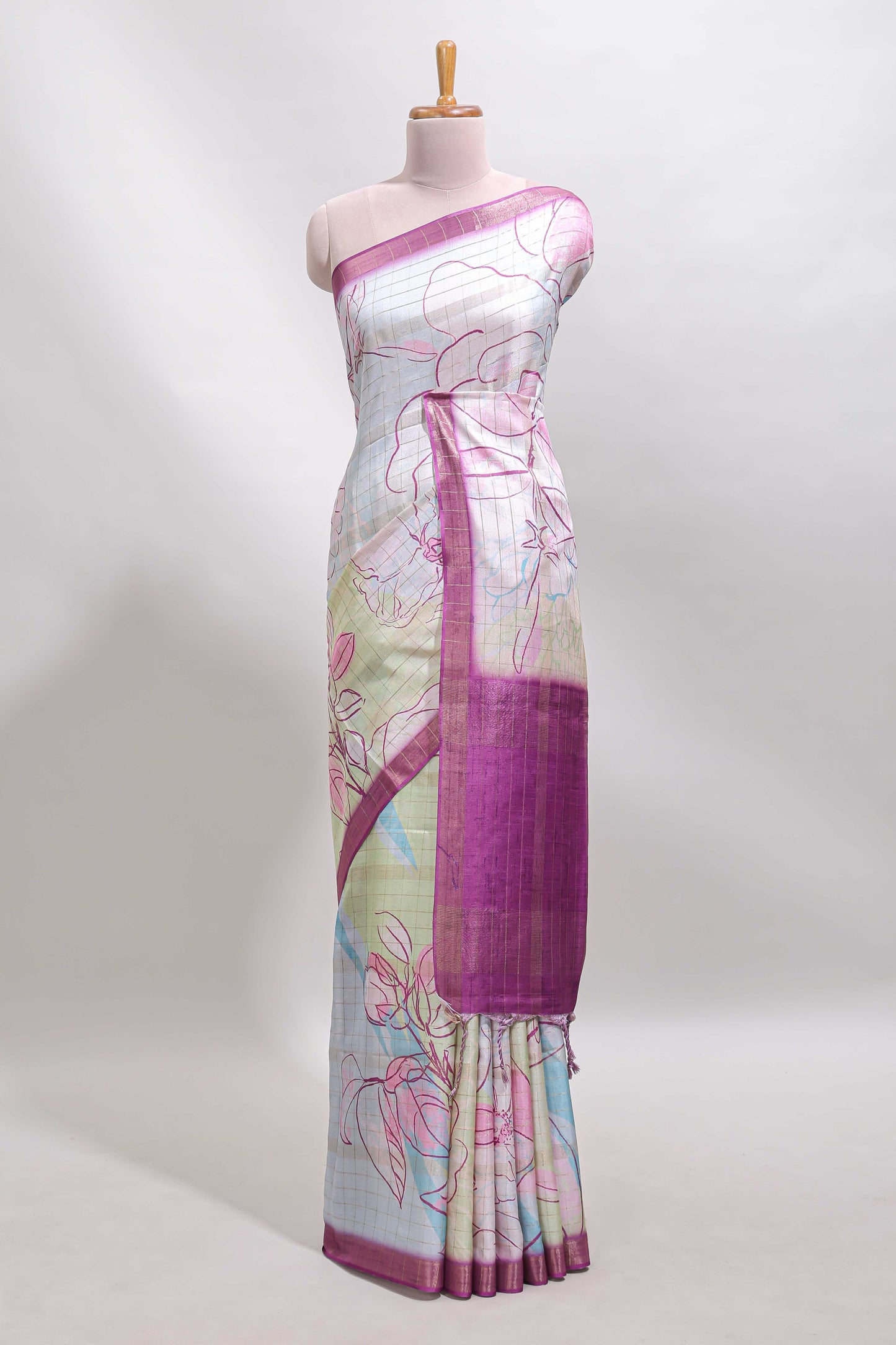 Multi color checked floral design tussar saree with contrast border and zari striped blouse