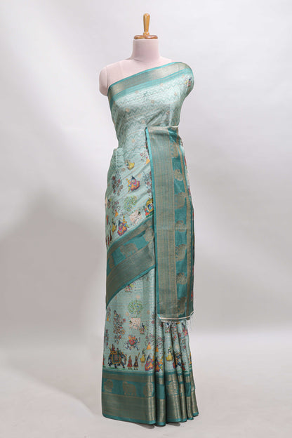Turquoise green pichwai print tussar saree with contrast zari border and matching blouse