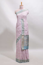Baby pink geometric design tussar saree with contrast zari border and striped blouse