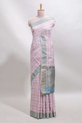 Baby pink geometric design tussar saree with contrast zari border and striped blouse