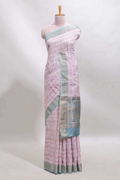 Baby pink geometric design tussar saree with contrast zari border and striped blouse