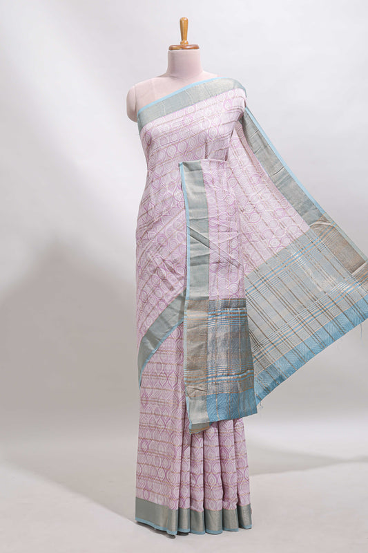 Baby pink geometric design tussar saree with contrast zari border and striped blouse