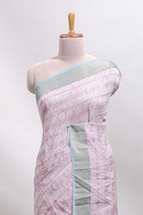 Baby pink geometric design tussar saree with contrast zari border and striped blouse
