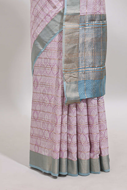 Baby pink geometric design tussar saree with contrast zari border and striped blouse