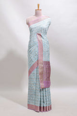 Blue geometric design tussar saree with contrast zari border and striped blouse