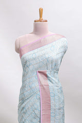 Blue geometric design tussar saree with contrast zari border and striped blouse