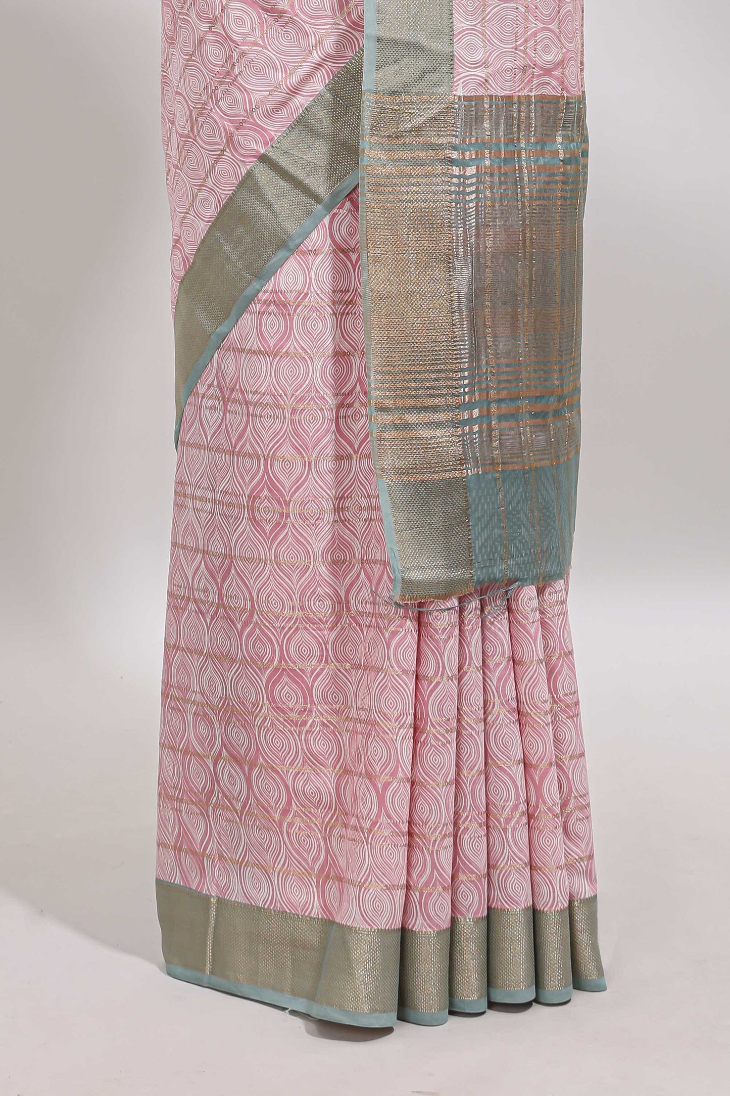 Peach geometric design tussar saree with contrast zari border and striped blouse