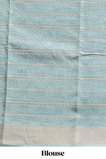 Peach geometric design tussar saree with contrast zari border and striped blouse
